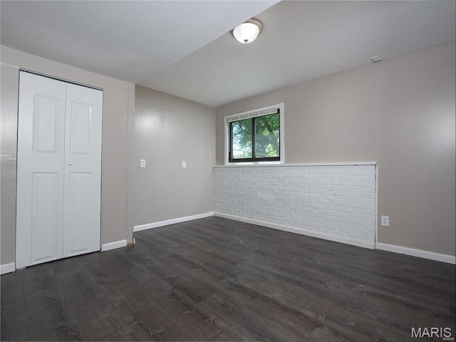 1464 Monopoly Dr, Florissant, MO 63031 - unfurnished bedroom featuring baseboards and dark wood-type flooring