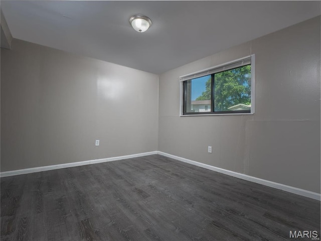 1464 Monopoly Dr, Florissant, MO 63031 - empty room featuring dark wood-style flooring and baseboards