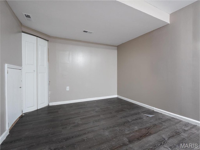 1464 Monopoly Dr, Florissant, MO 63031 - empty room featuring dark wood-style floors and baseboards