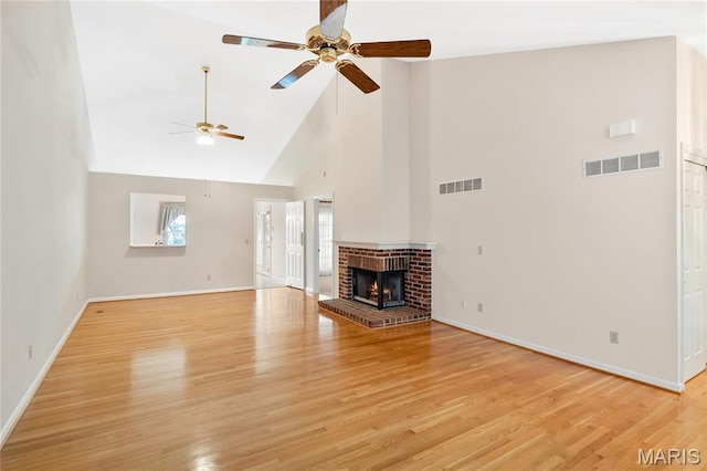 7310 Westover Colonial Ln, Saint Louis, MO 63119 - unfurnished living room with a ceiling fan, high vaulted ceiling, baseboards, and light wood-style floors