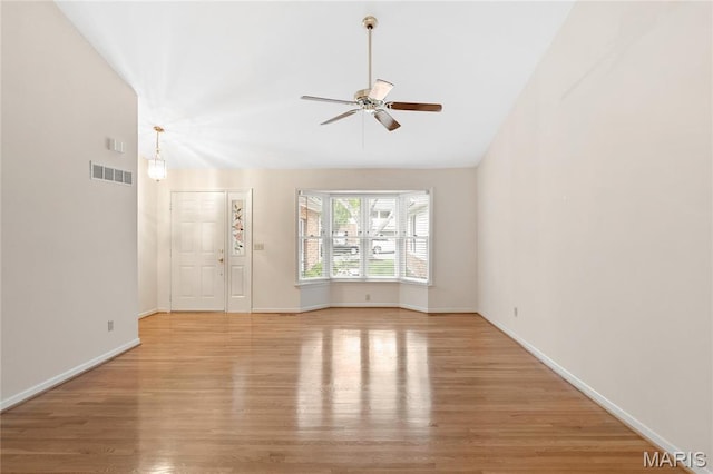 7310 Westover Colonial Ln, Saint Louis, MO 63119 - unfurnished living room featuring a ceiling fan, light wood-type flooring, baseboards, and lofted ceiling