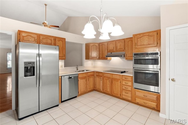 7310 Westover Colonial Ln, Saint Louis, MO 63119 - kitchen featuring stainless steel appliances, under cabinet range hood, a sink, light countertops, and lofted ceiling
