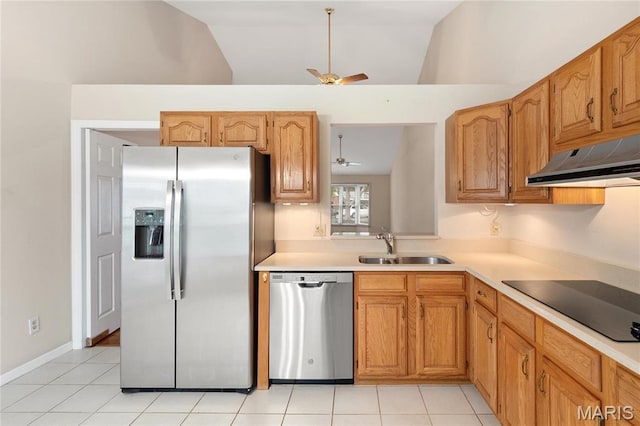 7310 Westover Colonial Ln, Saint Louis, MO 63119 - kitchen featuring stainless steel appliances, a ceiling fan, under cabinet range hood, vaulted ceiling, and a sink