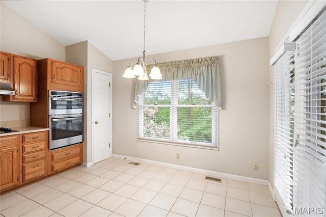 7310 Westover Colonial Ln, Saint Louis, MO 63119 - kitchen featuring double oven, a chandelier, vaulted ceiling, baseboards, and pendant lighting