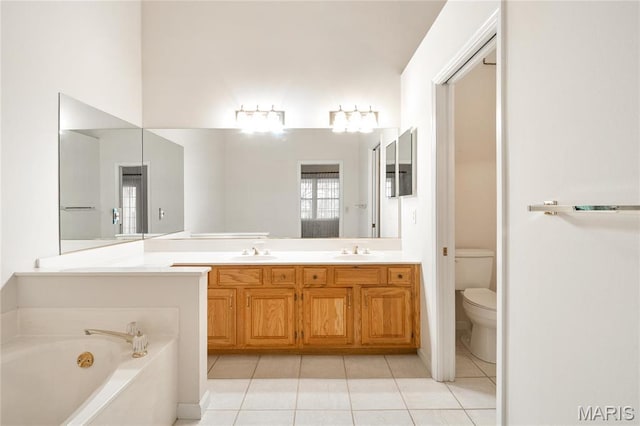 7310 Westover Colonial Ln, Saint Louis, MO 63119 - full bath featuring tile patterned floors, toilet, a garden tub, and double vanity