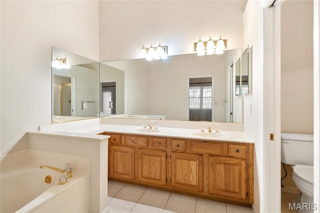 7310 Westover Colonial Ln, Saint Louis, MO 63119 - full bath with toilet, tile patterned floors, a garden tub, and double vanity