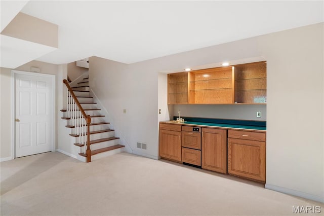 7310 Westover Colonial Ln, Saint Louis, MO 63119 - indoor wet bar with stairs, light colored carpet, baseboards, and recessed lighting
