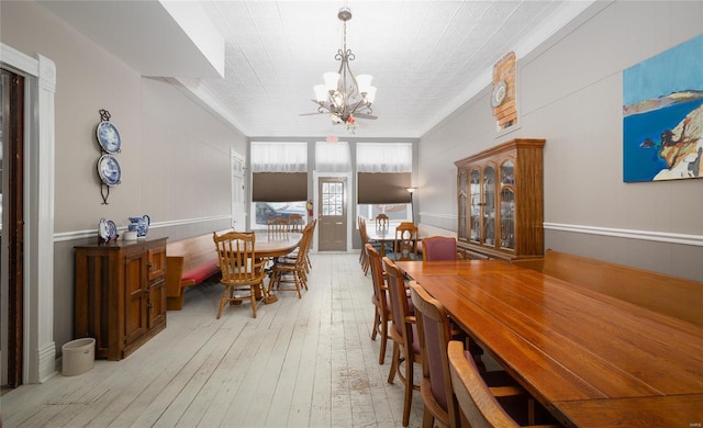 305 S Alvarado Ave, Belle, MO 65013 - dining space with a chandelier, wood-type flooring, and ornamental molding
