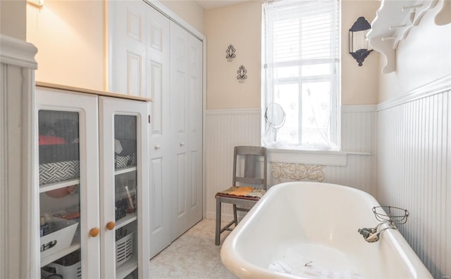 305 S Alvarado Ave, Belle, MO 65013 - full bathroom featuring wainscoting and a freestanding tub
