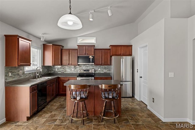 kitchen with stainless steel appliances, a sink, vaulted ceiling, dark countertops, and backsplash