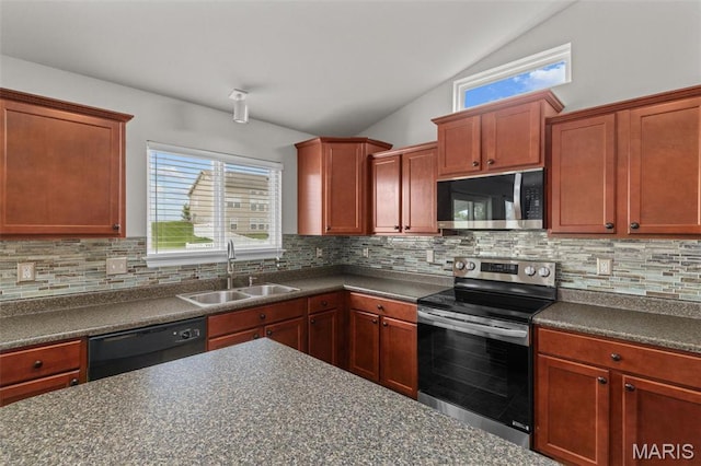 kitchen with stainless steel appliances, a sink, dark countertops, lofted ceiling, and tasteful backsplash
