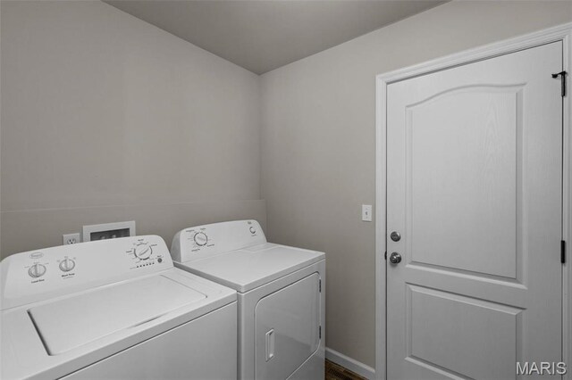 clothes washing area featuring independent washer and dryer