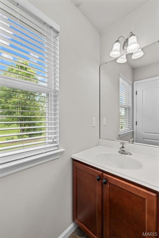 bathroom featuring vanity and baseboards