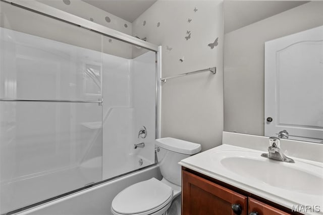 bathroom featuring vanity, toilet, and combined bath / shower with glass door