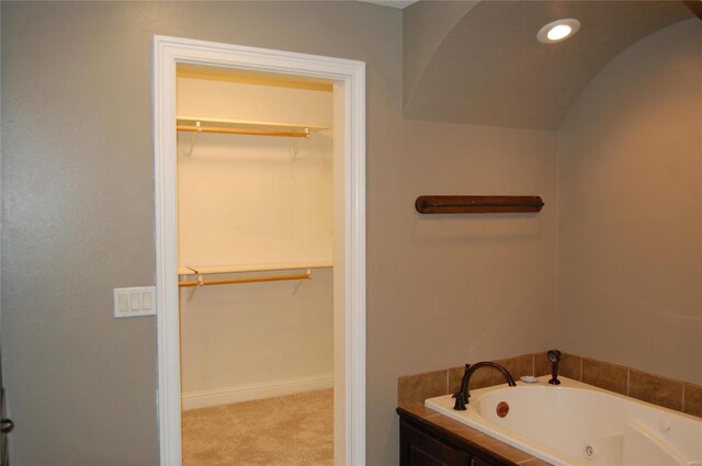 63 Bailey Rd, Poplar Bluff, MO 63901 - full bathroom featuring a jetted tub, a spacious closet, baseboards, and recessed lighting