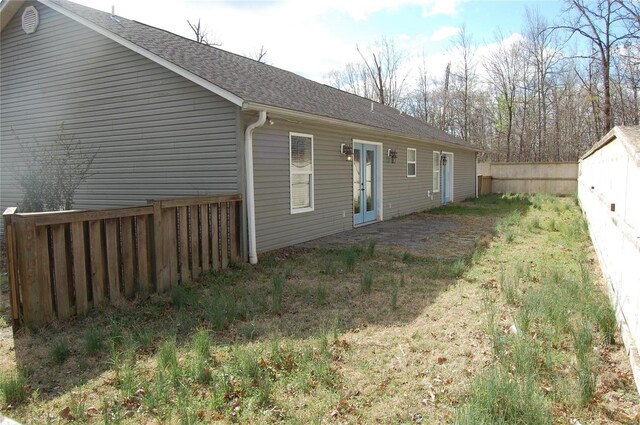 63 Bailey Rd, Poplar Bluff, MO 63901 - rear view of house featuring a fenced backyard, a shingled roof, and french doors