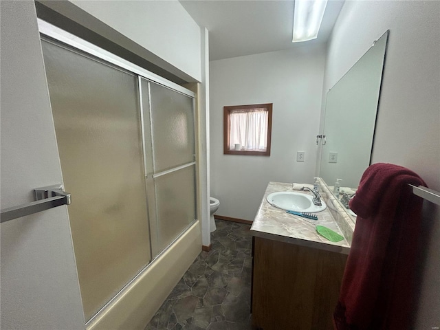 bathroom with toilet and vanity