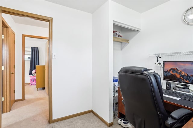 office area with light colored carpet and baseboards