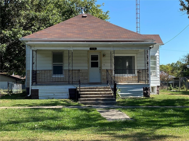 123 S Main St, Witt, IL 62094 - view of front facade with a porch, a front yard, and roof with shingles
