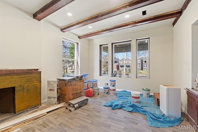 4 Lewis Pl, Saint Louis, MO 63113 - game room featuring beamed ceiling, a brick fireplace, baseboards, recessed lighting, and wood finished floors