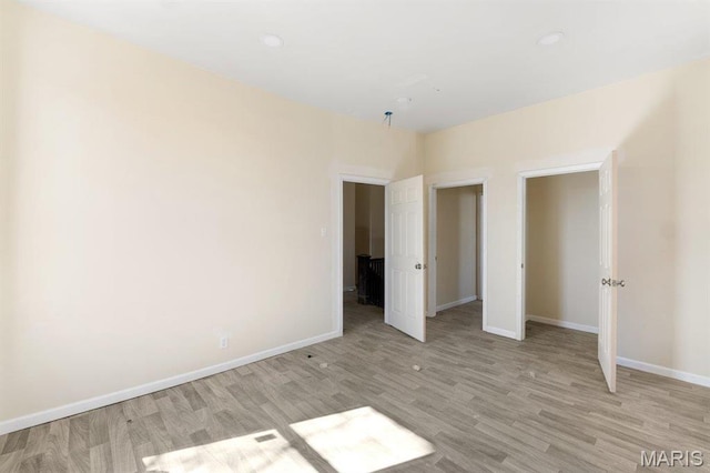 4 Lewis Pl, Saint Louis, MO 63113 - unfurnished bedroom with light wood-style floors, baseboards, and recessed lighting