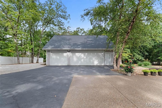 garage with fence