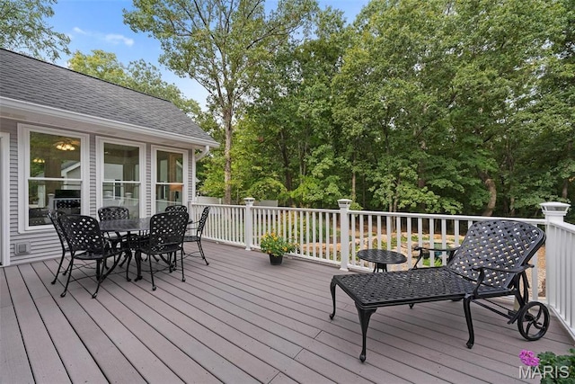deck with outdoor dining space