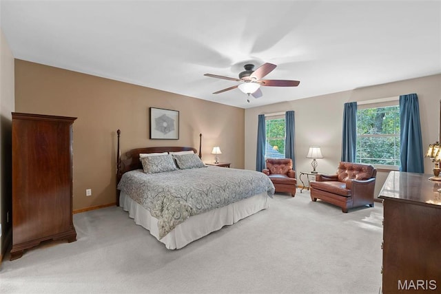 bedroom with light colored carpet and ceiling fan