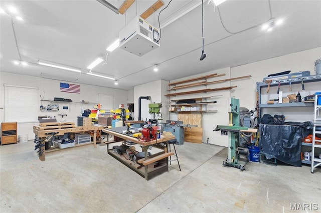 garage featuring a workshop area and a heating unit