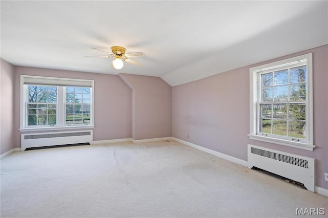910 Kent Rd, Ladue, MO 63124 - additional living space featuring radiator, carpet, vaulted ceiling, and a ceiling fan