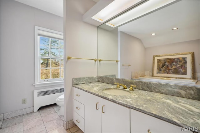 910 Kent Rd, Ladue, MO 63124 - bathroom with radiator heating unit, vanity, and recessed lighting