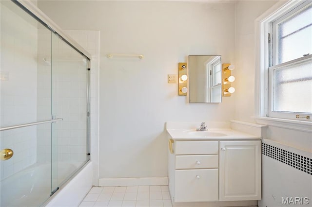 910 Kent Rd, Ladue, MO 63124 - full bathroom with radiator heating unit, vanity, tile patterned floors, and enclosed tub / shower combo