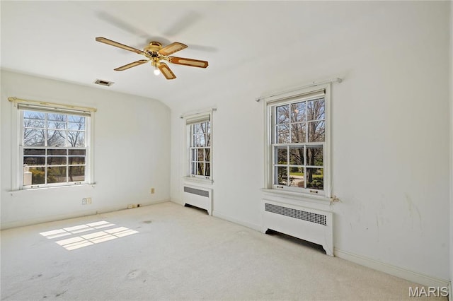 910 Kent Rd, Ladue, MO 63124 - carpeted empty room featuring radiator and ceiling fan