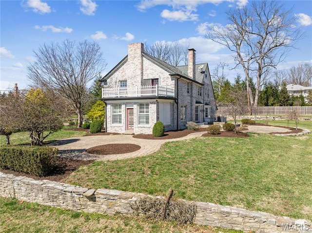 910 Kent Rd, Ladue, MO 63124 - back of property with a balcony, a chimney, and stone siding