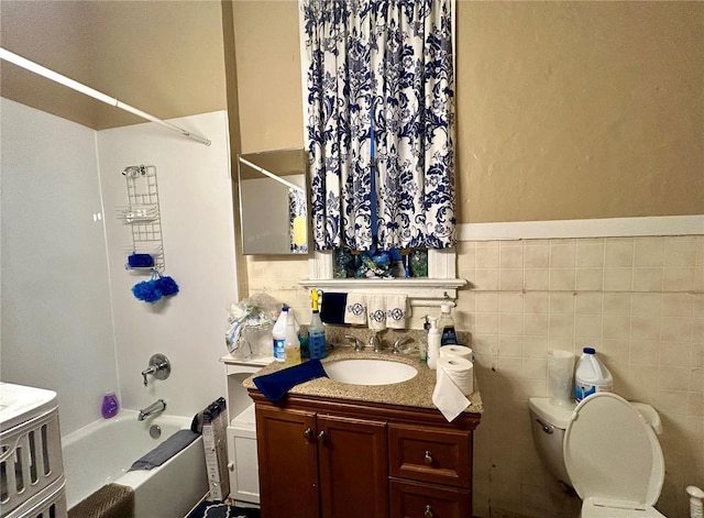 1426 N Newstead Ave, Saint Louis, MO 63113 - bathroom featuring vanity, toilet, bathtub / shower combination, and wainscoting