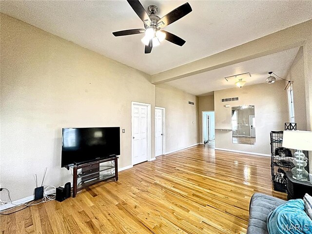 703 S Main St, Troy, IL 62294 - living room with light wood-style flooring, a ceiling fan, and baseboards