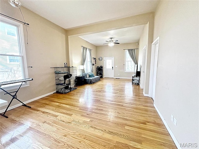 703 S Main St, Troy, IL 62294 - living room featuring light wood finished floors, baseboards, and ceiling fan