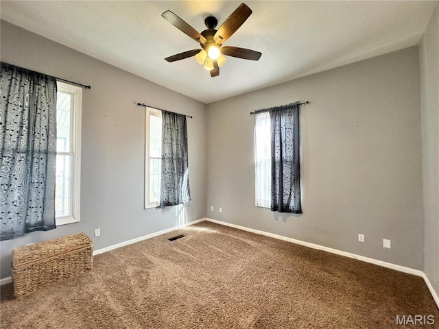 703 S Main St, Troy, IL 62294 - carpeted empty room featuring a ceiling fan, healthy amount of natural light, and baseboards