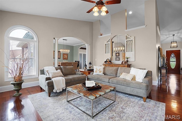 2009 Weber Heights Dr, Washington, MO 63090 - living room featuring arched walkways, decorative columns, ceiling fan, hardwood / wood-style floors, and a towering ceiling