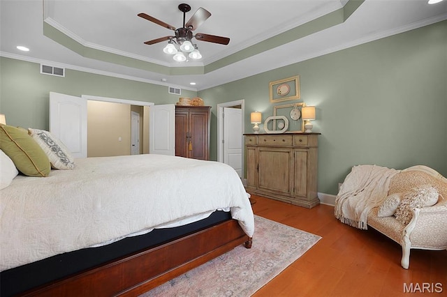 2009 Weber Heights Dr, Washington, MO 63090 - bedroom featuring a raised ceiling, light wood-style floors, crown molding, recessed lighting, and baseboards