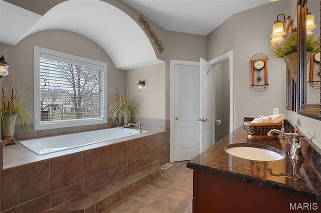 2009 Weber Heights Dr, Washington, MO 63090 - full bathroom featuring a garden tub, double vanity, and tile patterned flooring