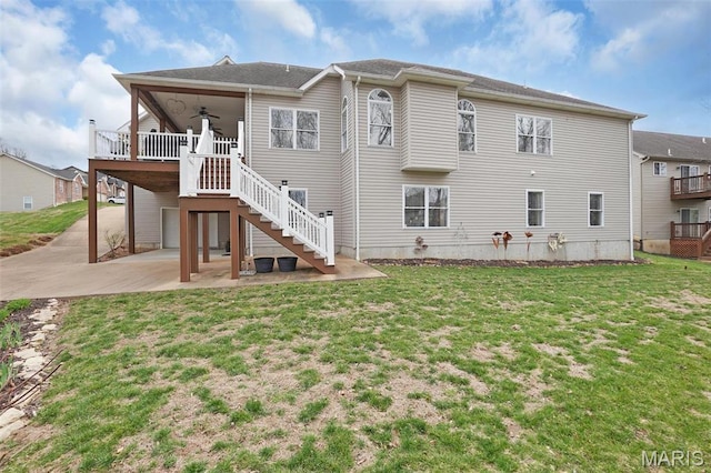 2009 Weber Heights Dr, Washington, MO 63090 - rear view of house with a ceiling fan, a patio, a yard, and stairs