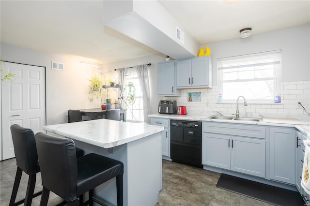 11921 Villa Dorado Dr Unit F, Saint Louis, MO 63146 - kitchen with dishwasher, a sink, a kitchen bar, and healthy amount of natural light