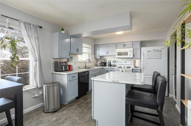 11921 Villa Dorado Dr Unit F, Saint Louis, MO 63146 - kitchen with white appliances, a sink, tasteful backsplash, and baseboards