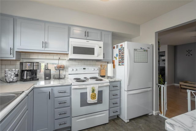11921 Villa Dorado Dr Unit F, Saint Louis, MO 63146 - kitchen with white appliances, gray cabinets, dark wood-style floors, and backsplash