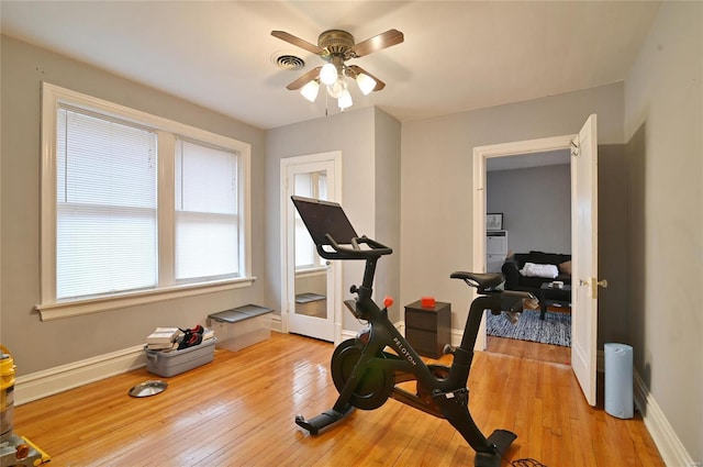 7227 Dartmouth Ave, Saint Louis, MO 63130 - exercise room featuring light wood-style floors, baseboards, and a ceiling fan