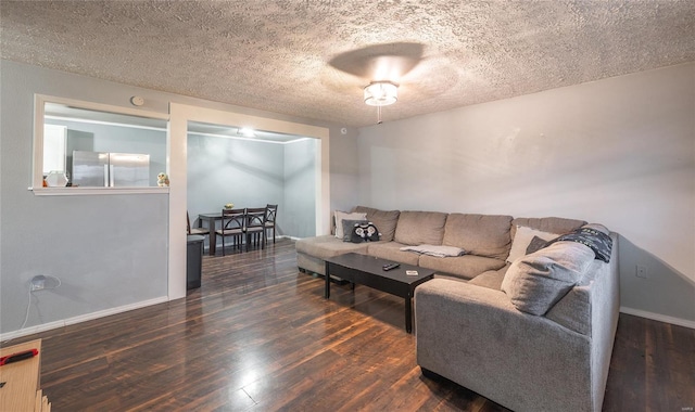 15105 Transit Rd, Saint Robert, MO 65584 - living area with a textured ceiling, wood finished floors, and baseboards