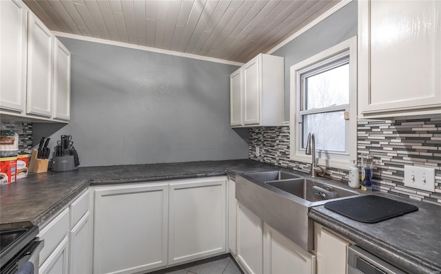 15105 Transit Rd, Saint Robert, MO 65584 - kitchen with tasteful backsplash, ornamental molding, dark countertops, white cabinetry, and a sink