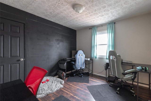15105 Transit Rd, Saint Robert, MO 65584 - office space featuring a textured ceiling, wood finished floors, and an accent wall