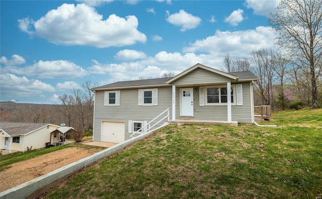 15105 Transit Rd, Saint Robert, MO 65584 - ranch-style house featuring a garage, driveway, and a front lawn
